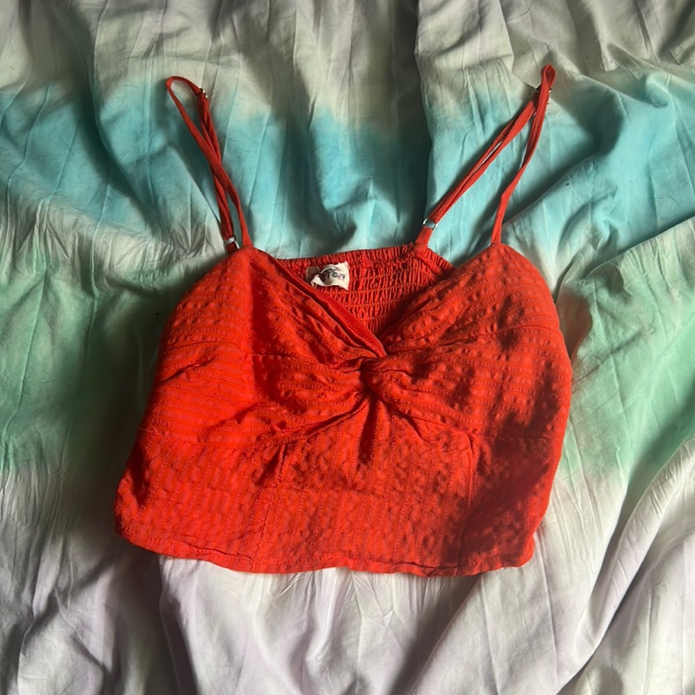 Super cute tank with a fun knot in the front